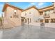 Rear exterior showcasing patio, staircase, and ample parking at 10412 Mansion Hills Ave, Las Vegas, NV 89144