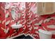Quirky powder room with crane wallpaper, black marble floor and modern sink at 10412 Mansion Hills Ave, Las Vegas, NV 89144