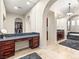 Primary bathroom with granite vanity, makeup area and walk in closet at 10412 Mansion Hills Ave, Las Vegas, NV 89144