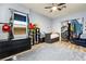 Bedroom with unique decor, modern furnishings, and large window at 10412 Mansion Hills Ave, Las Vegas, NV 89144