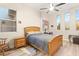 Cozy bedroom with wood furniture, soft rug, and bright natural light at 10412 Mansion Hills Ave, Las Vegas, NV 89144