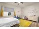 Bright bedroom featuring modern decor, a crib, and a comfortable armchair at 10412 Mansion Hills Ave, Las Vegas, NV 89144