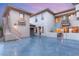 Spacious driveway with a courtyard featuring an outdoor seating area at 10412 Mansion Hills Ave, Las Vegas, NV 89144