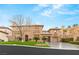 Stately home with manicured front lawn, circular driveway, and mature landscaping at 10412 Mansion Hills Ave, Las Vegas, NV 89144