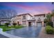 Elegant two-story home featuring well-manicured lawn and a spacious driveway at 10412 Mansion Hills Ave, Las Vegas, NV 89144