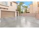 Spacious garage and extended driveway with additional parking and neutral exterior at 10412 Mansion Hills Ave, Las Vegas, NV 89144