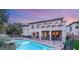 Backyard pool area with a safety fence and mature landscaping at 10412 Mansion Hills Ave, Las Vegas, NV 89144