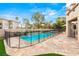 Gorgeous pool and spa with a safety fence and beautiful patio surroundings at 10412 Mansion Hills Ave, Las Vegas, NV 89144