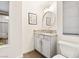 Elegant powder room with granite countertop, decorative mirror, and modern fixtures at 10412 Mansion Hills Ave, Las Vegas, NV 89144