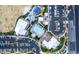 Aerial view of community amenities including pool, park, clubhouse, and parking for residents' convenience at 10604 Sariah Skye Ave, Las Vegas, NV 89166
