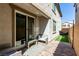 Private backyard patio with comfortable seating and sliding glass door access at 10604 Sariah Skye Ave, Las Vegas, NV 89166