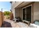 Paver patio with outdoor seating and access to the home through a sliding glass door at 10604 Sariah Skye Ave, Las Vegas, NV 89166