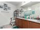 Double vanity in bathroom with granite countertops, two sinks, and tile flooring at 10604 Sariah Skye Ave, Las Vegas, NV 89166