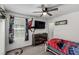 Bedroom with carpet, ceiling fan, and Spiderman themed wall decor at 10604 Sariah Skye Ave, Las Vegas, NV 89166