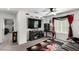 Cozy bonus room with a ceiling fan, TV, movie-themed decor, and comfortable seating for entertainment at 10604 Sariah Skye Ave, Las Vegas, NV 89166