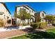 Charming two-story home featuring neutral stucco, arched entry, shutters, and a well-maintained front yard at 10604 Sariah Skye Ave, Las Vegas, NV 89166