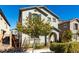 Charming two-story home featuring neutral stucco, arched entry, shutters, and a well-maintained front yard at 10604 Sariah Skye Ave, Las Vegas, NV 89166
