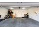 Spacious garage with ample storage, painted floor, and a door to the house at 10604 Sariah Skye Ave, Las Vegas, NV 89166