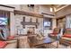 Cozy community lobby with stone fireplace, comfortable seating, and mounted TVs at 10604 Sariah Skye Ave, Las Vegas, NV 89166