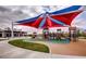 Colorful playground with climbing structures and slides, perfect for Gathering fun and outdoor activities at 10604 Sariah Skye Ave, Las Vegas, NV 89166