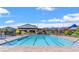 Resort-style pool with clear blue water, lounge chairs, and lifeguard station for relaxation and recreation at 10604 Sariah Skye Ave, Las Vegas, NV 89166