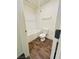 Bright bathroom featuring a shower-tub combination, white walls, and wood-look floors at 1163 Meadow Sparrow Pl, Henderson, NV 89011