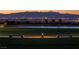 Beautiful lake surrounded by grassy field, benches and street lamps at 1163 Meadow Sparrow Pl, Henderson, NV 89011