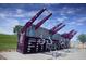 Cadence community outdoor fitness area with purple and silver workout equipment and lush green landscaping at 1163 Meadow Sparrow Pl, Henderson, NV 89011