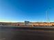 Future Cadence sports park sign adjacent to a paved street and large lot with mountain views at 1163 Meadow Sparrow Pl, Henderson, NV 89011