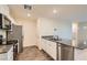 Modern kitchen with stainless steel appliances, granite countertops and white cabinetry at 1163 Meadow Sparrow Pl, Henderson, NV 89011