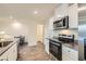 Well-equipped kitchen featuring stainless steel appliances and granite countertops at 1163 Meadow Sparrow Pl, Henderson, NV 89011