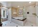 Bright bathroom features a soaking tub and separate glass enclosed shower at 145 E Harmon Ave # 2021, Las Vegas, NV 89109