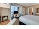 Bright bedroom featuring a queen-size bed, media center, and walk-in closet at 145 E Harmon Ave # 2021, Las Vegas, NV 89109