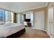 Bright bedroom featuring a queen-size bed, media center, large windows and neutral decor at 145 E Harmon Ave # 2021, Las Vegas, NV 89109