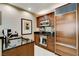 Close up of small kitchen with dark wooden cabinets and stainless steel appliances at 145 E Harmon Ave # 2021, Las Vegas, NV 89109