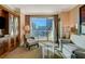 Bright living room featuring modern furnishings, a large window, and stunning city views at 145 E Harmon Ave # 2021, Las Vegas, NV 89109