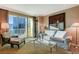 Bright living room featuring modern furnishings, a large window, and city views at 145 E Harmon Ave # 2021, Las Vegas, NV 89109