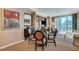 Well-lit living room with modern decor, plush seating, and a large window offering city views at 145 E Harmon Ave # 2021, Las Vegas, NV 89109