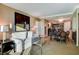 Bright and airy living room with modern decor, plush seating, and a partial view of the kitchen area at 145 E Harmon Ave # 2021, Las Vegas, NV 89109