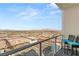 Balcony view with comfortable seating and mountain range in the background at 150 Las Vegas Blvd # 2015, Las Vegas, NV 89101
