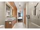 Luxurious bathroom with double vanity, spacious shower, and modern design, leading to bedroom at 150 Las Vegas Blvd # 2015, Las Vegas, NV 89101