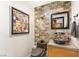 Modern bathroom boasts brick accent wall, vessel sink, and gray fixtures, showcasing contemporary style at 150 Las Vegas Blvd # 2015, Las Vegas, NV 89101