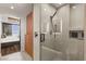 Walk in shower boasts modern tile, rainfall shower head, and sleek fixtures, with bedroom view at 150 Las Vegas Blvd # 2015, Las Vegas, NV 89101