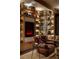 Cozy den features built-in bookshelves, a fireplace, and a comfortable leather armchair at 150 Las Vegas Blvd # 2015, Las Vegas, NV 89101