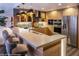 Stylish kitchen featuring a breakfast bar, wood cabinets, modern appliances, and elegant pendant lighting over the counter at 150 Las Vegas Blvd # 2015, Las Vegas, NV 89101