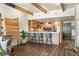 Contemporary kitchen and seating area with wood accents, sleek countertops, modern lighting, and stainless steel appliances at 150 Las Vegas Blvd # 2015, Las Vegas, NV 89101