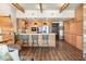 Modern kitchen featuring wood cabinets, stainless steel appliances, a breakfast bar with stools, and stylish pendant lighting at 150 Las Vegas Blvd # 2015, Las Vegas, NV 89101