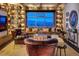 Inviting living room with custom bookshelves, exposed brick, and scenic city views at 150 Las Vegas Blvd # 2015, Las Vegas, NV 89101