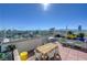 Rooftop terrace with comfortable seating and panoramic views of the city skyline and mountains at 150 Las Vegas Blvd # 2015, Las Vegas, NV 89101