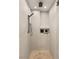 Modern shower features gray tile, rainfall showerhead, and built-in niche for toiletries at 150 Las Vegas Blvd # 2015, Las Vegas, NV 89101